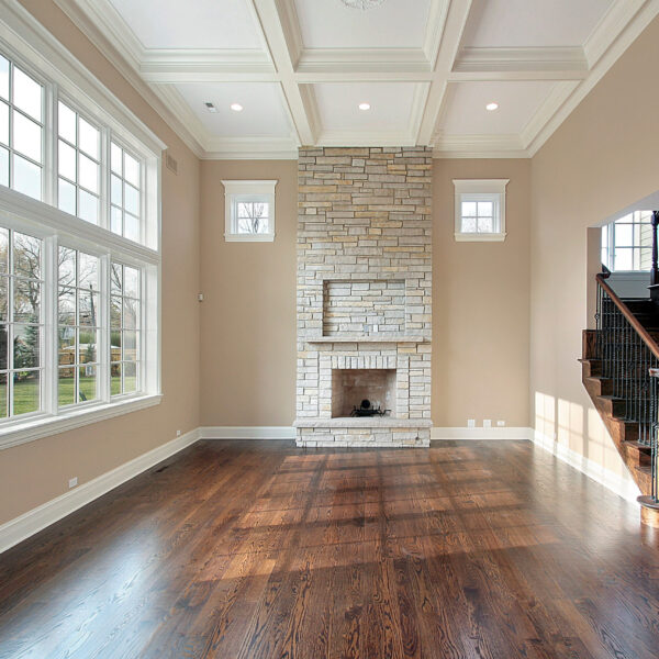 Family room in new construction home with two story fireplace